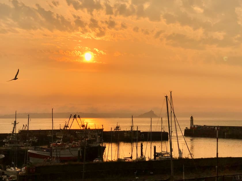 A magical morning view. Past the breakwater to a hazy silhouette of St Micheal’s mount | Old Quay, Newlyn