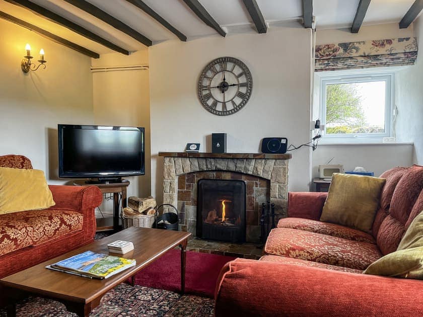 Lounge with original beams & open fireplace | Throwley Cottage - Throwley Hall, Ilam, near Ashbourne