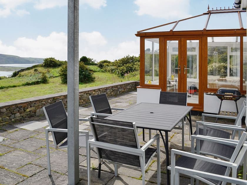 The patio area has stunning views of the Mawddach area and out to sea  Snowdonia Mountains and Coast, Wales | Caefadog Fach, Barmouth