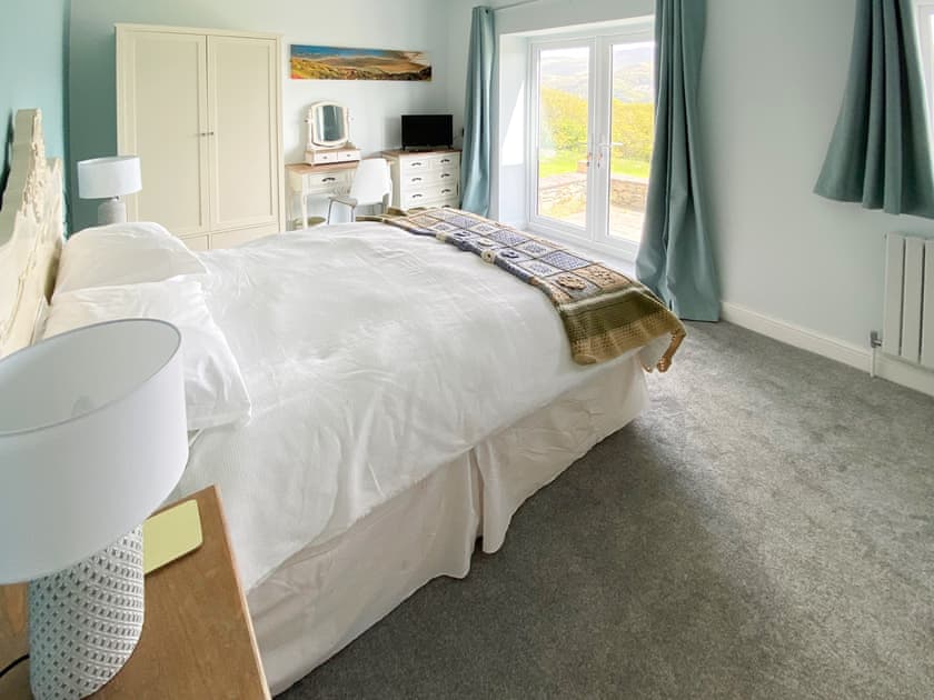 The second double bedroom has access to the patio | Caefadog Fach, Barmouth