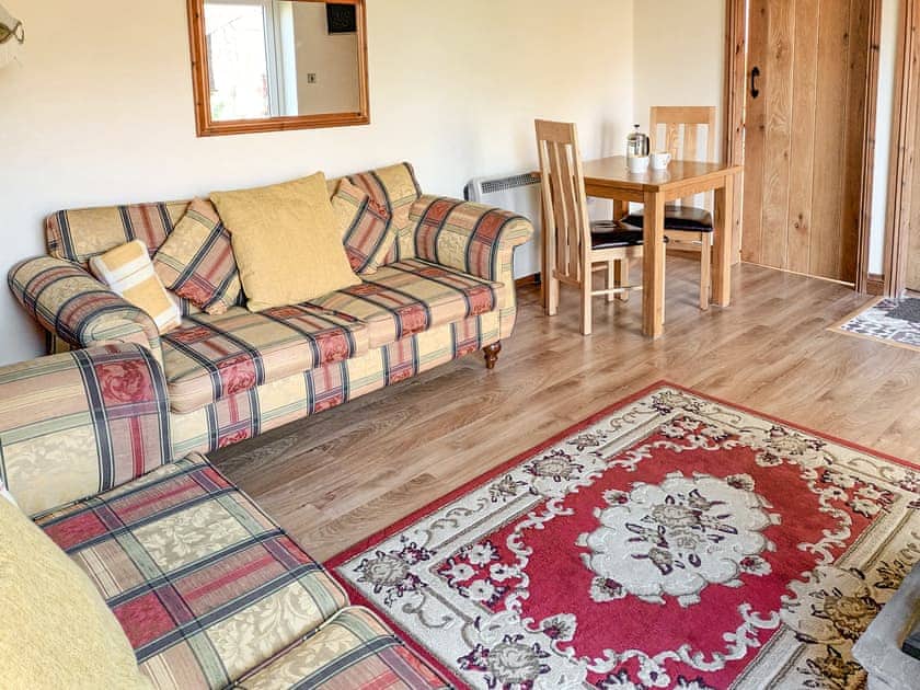 Welcoming living area with wood burner | Hillcrest Cottage, Broxa near Scarborough