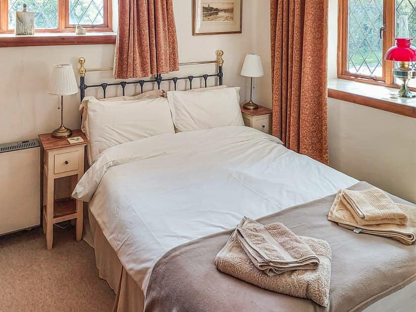 Warm and welcoming double bedroom | Hunt Cottage, Sharrington, near Holt