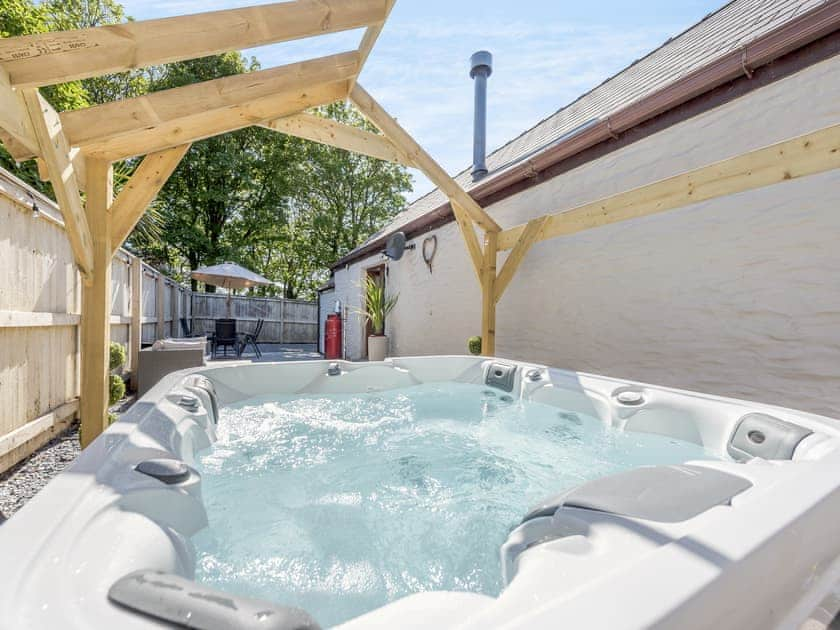 Hot tub | Hunters Lodge - Mellaston Cottages, Hundleton, near Pembroke