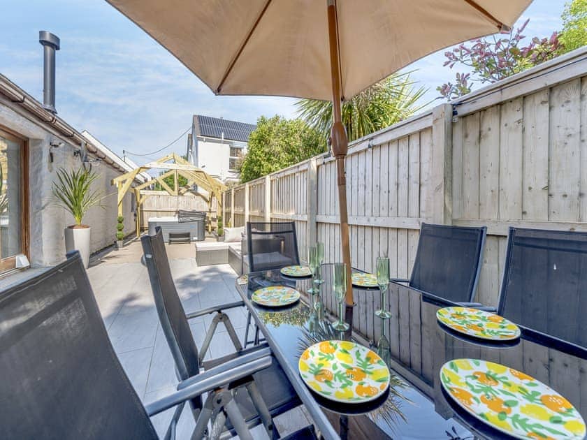 Sitting-out-area | Hunters Lodge - Mellaston Cottages, Hundleton, near Pembroke