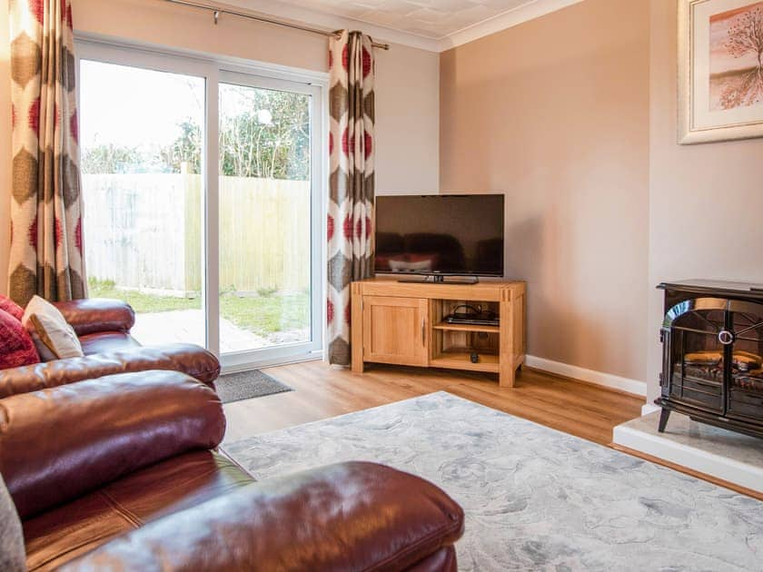 Living area | Bosun’s Cabin - Celtic Haven Resort, Lydstep, near Tenby