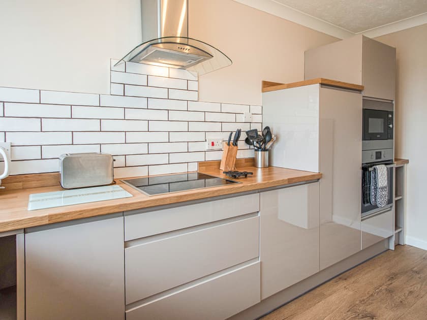 Kitchen | Bosun’s Cabin - Celtic Haven Resort, Lydstep, near Tenby