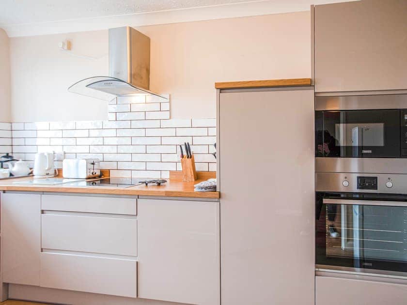 Kitchen | Bosun’s Cabin - Celtic Haven Resort, Lydstep, near Tenby