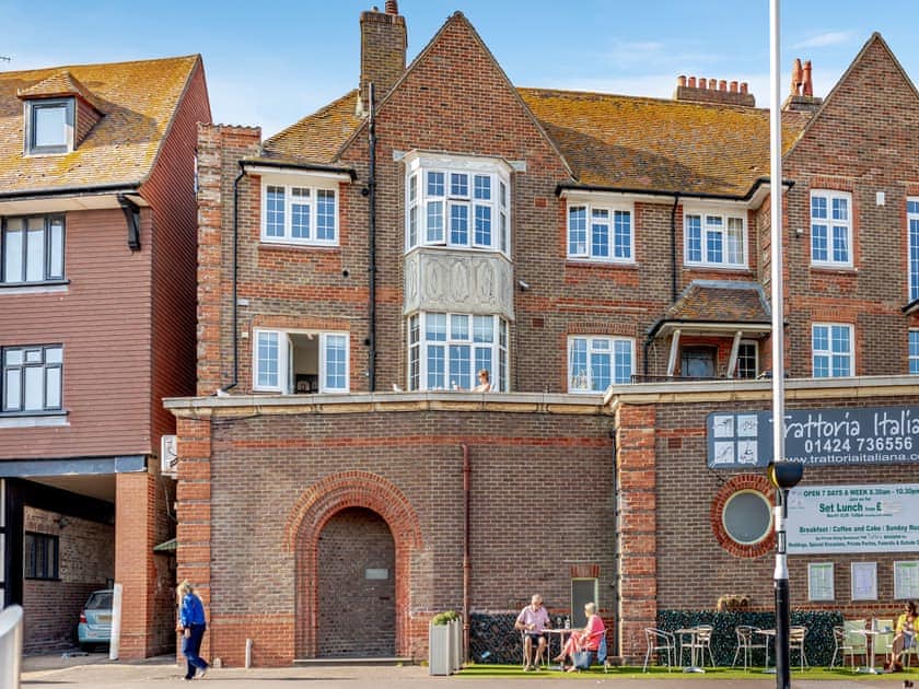 Exterior. Archway leads to the stairs | Crossways Mansions, Bexhill-on-Sea