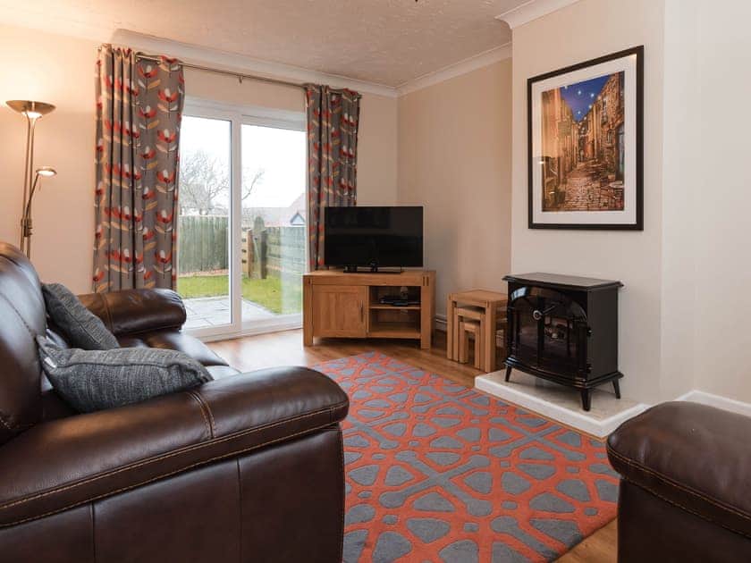 Living room | Dolphin Cottage - Celtic Haven Resort, Lydstep, near Tenby