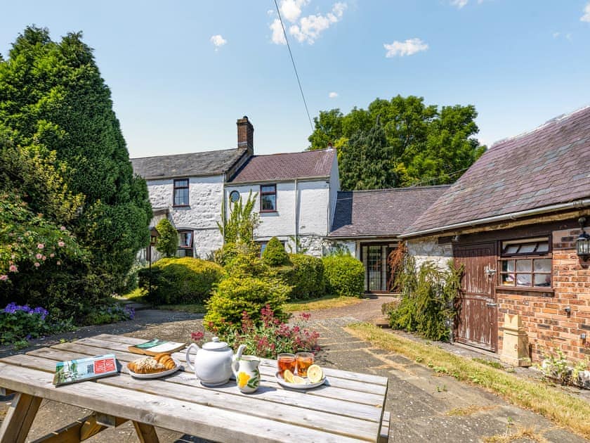 Sitting-out-area | The Farmhouse - Pen y Bryn Farm and Holiday Cottages, Betws Yn Rhos