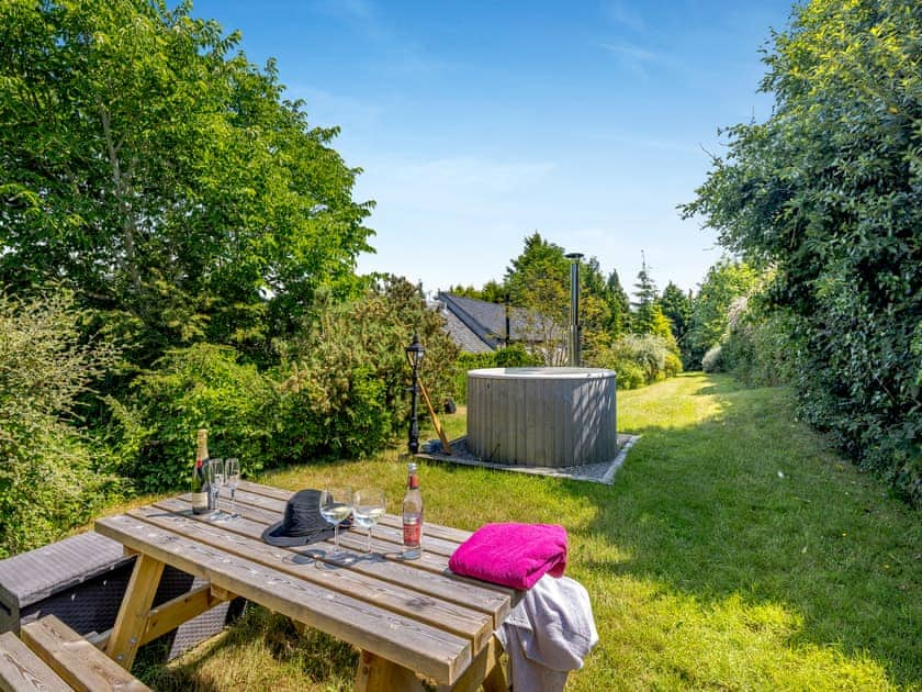 Cottages hot tub and sitting-out-area  | Primrose Cottage - Pen y Bryn Farm and Holiday Cottages, Betws Yn Rhos