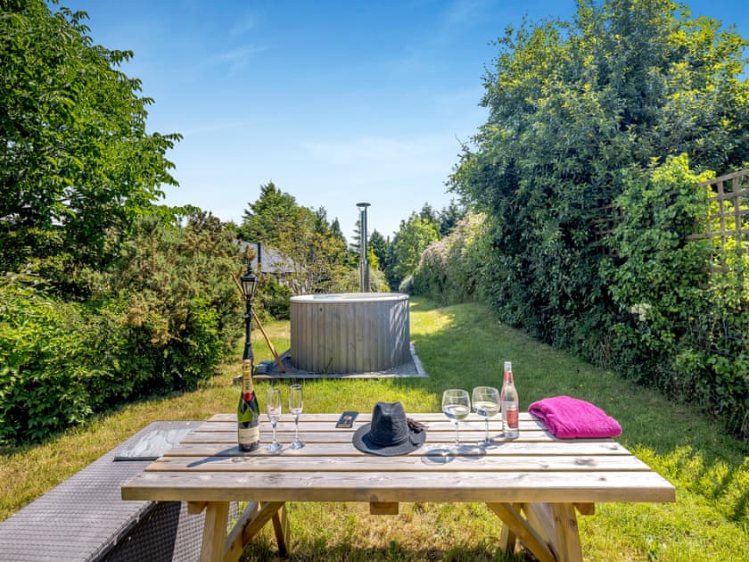 Cottages hot tub and sitting-out-area  | Primrose Cottage - Pen y Bryn Farm and Holiday Cottages, Betws Yn Rhos