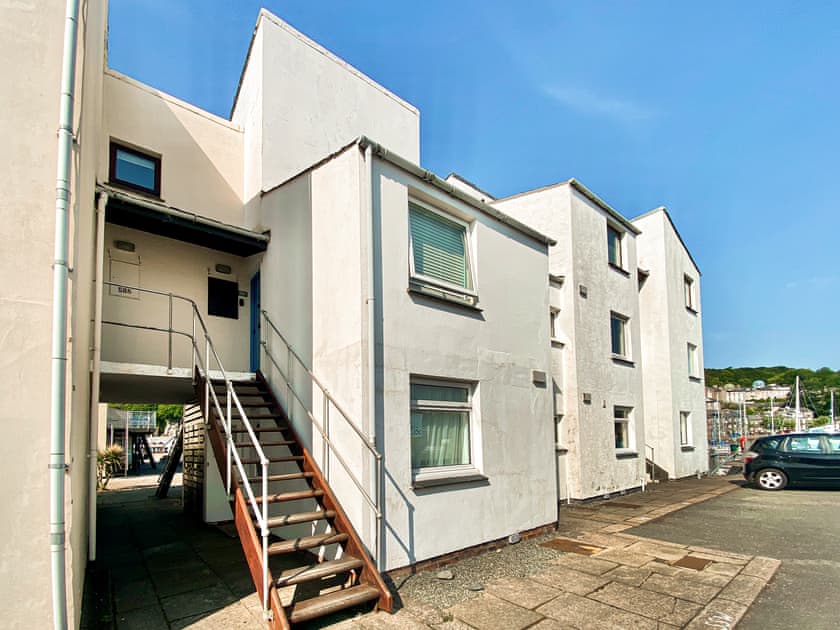 Exterior, wooden external staircase up to the front door on the 1st floor  | Dros Y Dwr, Porthmadog