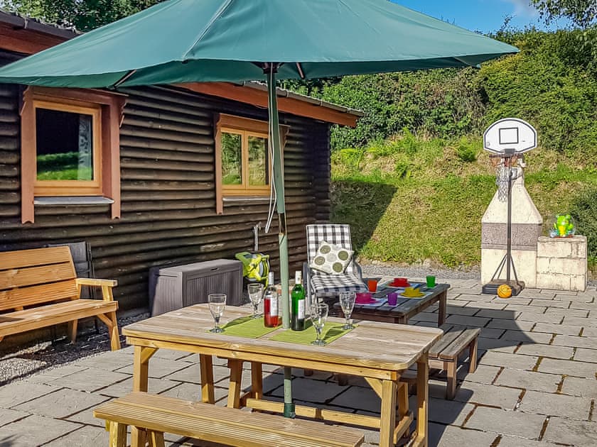 Patio area with seating | Sunnybank Lodge, Llanfynydd