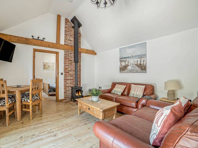 Open-plan living room with a wood-burning stove | Little Tree Cottage, Skeyton, near Norwich