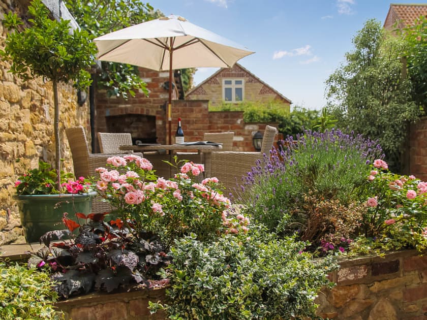 Colourful patio garden | Pond View Cottage, Brantingham, near Beverley