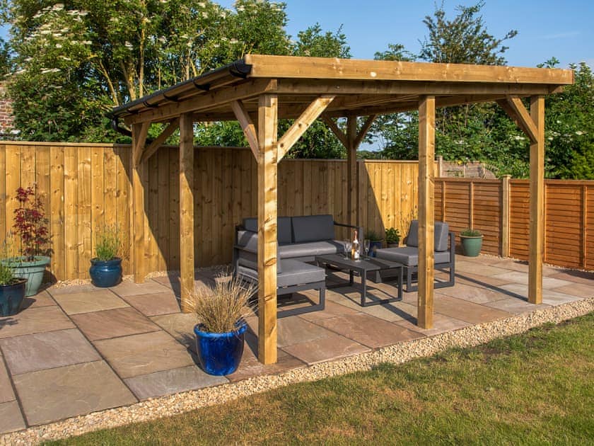 Paved patio area with outdoor furniture | Waves and Wolds, Sewerby, near Bridlington