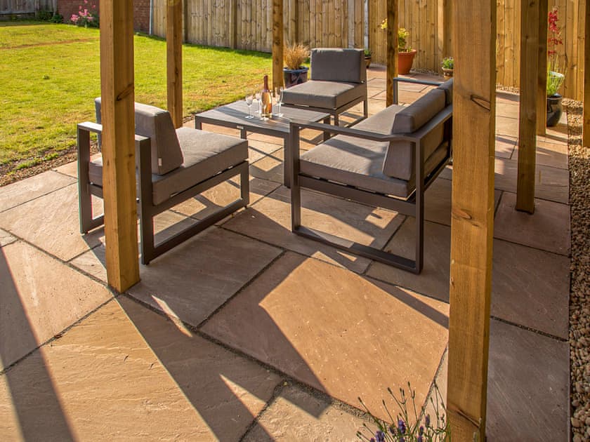 Paved patio area with outdoor furniture | Waves and Wolds, Sewerby, near Bridlington
