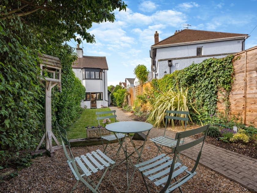 Looking down the garden towards the cottage from the sitting area (with BBQ) | Greenfield Cottage 1866, Worthing