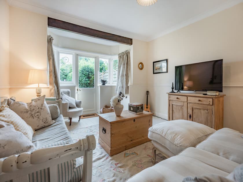 Comfortable living room area with two sofa’s and smart TV | Greenfield Cottage 1866, Worthing