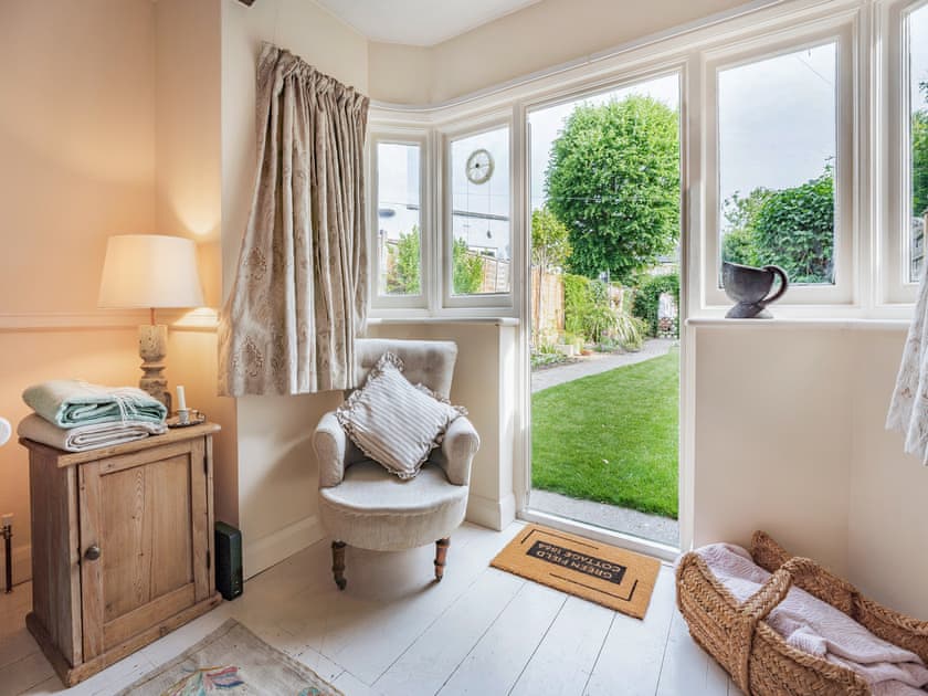 Living room with door that opens up onto the secluded garden which is a lovely feature in the summer months and enables you to keep an eye on children and pets from the open plan living arrangement | Greenfield Cottage 1866, Worthing