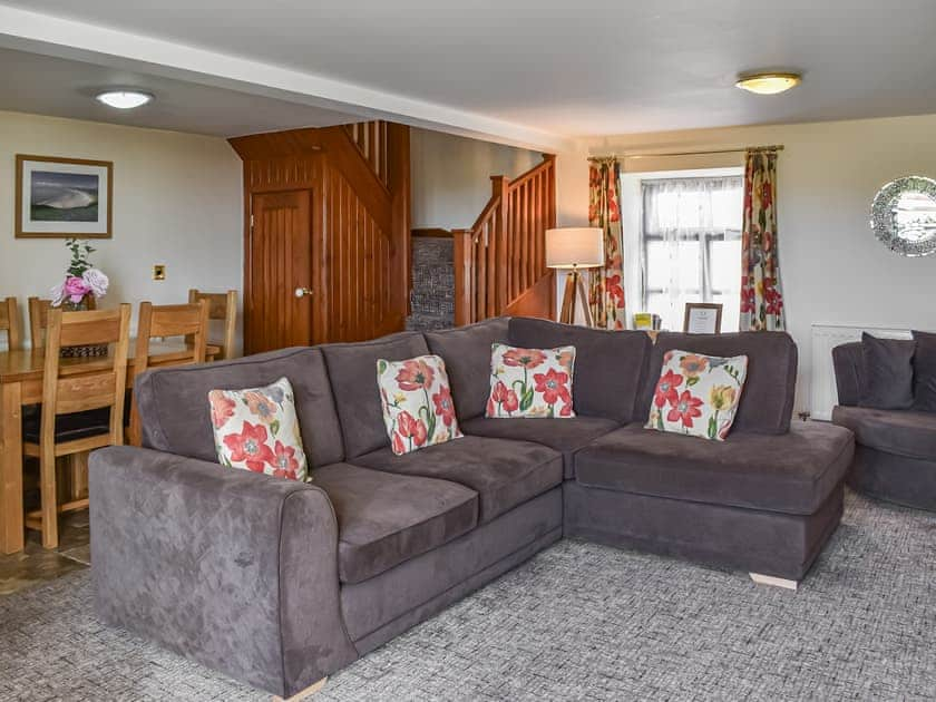 Stylish wall mounted fire in living area | Beudy Hen - Beudy Hen and Ysgubor, Llanfair, near Harlech