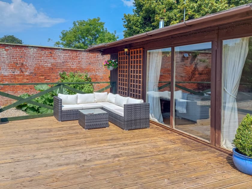 Sitting-out-area | Pampita Lodge - Tickton Hall Cottages, Beverley