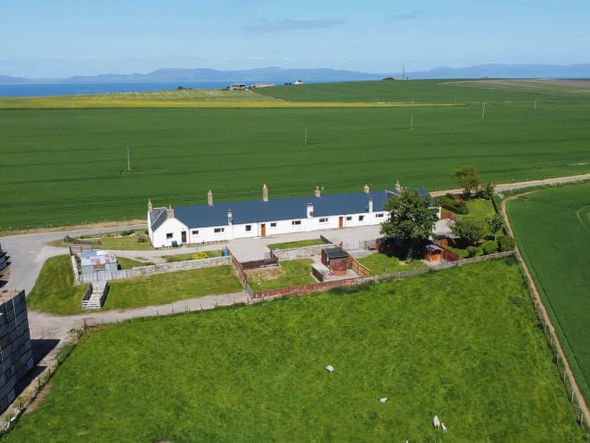 Aerial photo showing the surrounding countryside and the property’s proximity to the coast | The Paddock, Portmahomack, near Tain
