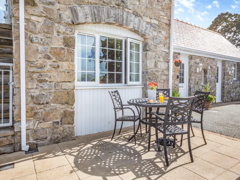 Sitting-out-area | Bryn Awelon Bach - Moelfre Cottages, Moelfre, near Benllech
