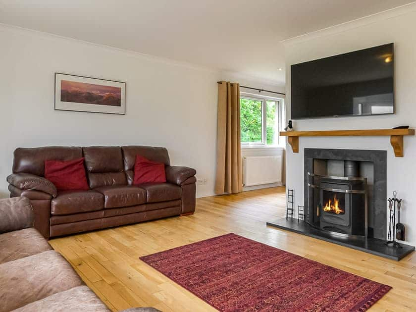 Welcoming living room with wood burner | Lapwing Rise, Banavie, near Fort William