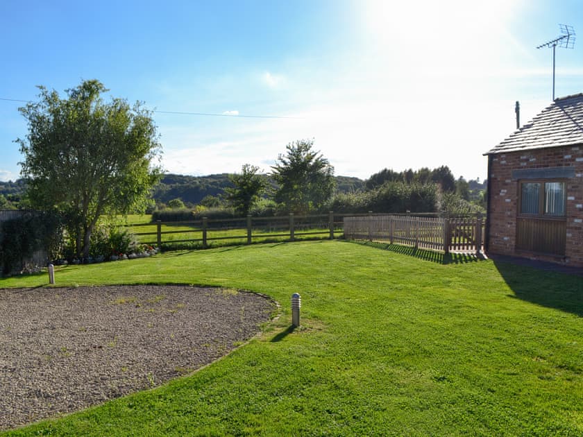 Garden surrounded by lush countryside | Blackberry Barn - Middle Huntingford Barns, Charfield, near Wotton-under-Edge