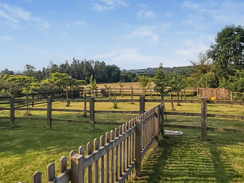 Garden surrounded by lush countryside | Blackberry Barn - Middle Huntingford Barns, Charfield, near Wotton-under-Edge
