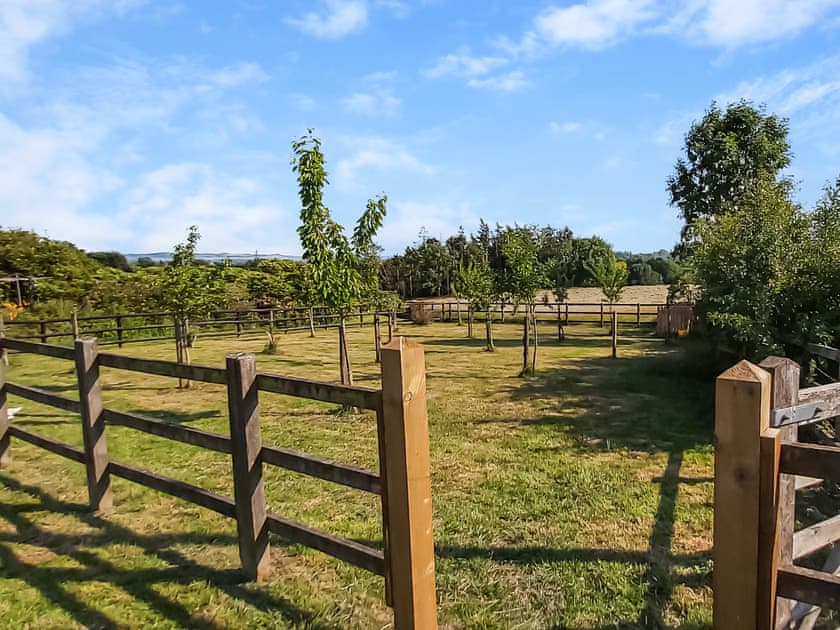 Garden surrounded by lush countryside | Blackberry Barn - Middle Huntingford Barns, Charfield, near Wotton-under-Edge