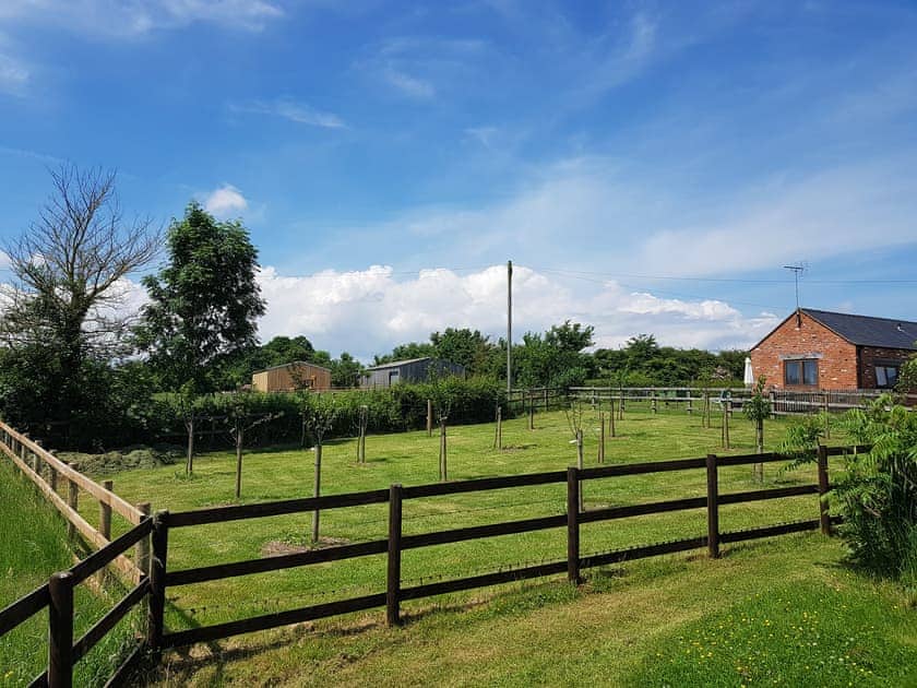 Garden surrounded by lush countryside | Blackberry Barn - Middle Huntingford Barns, Charfield, near Wotton-under-Edge