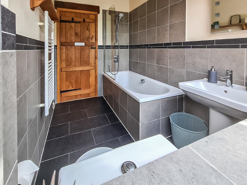 Family bathroom with shower over bath | Bramble Barn - Middle Huntingford Barns, Charfield, near Wotton-under-Edge