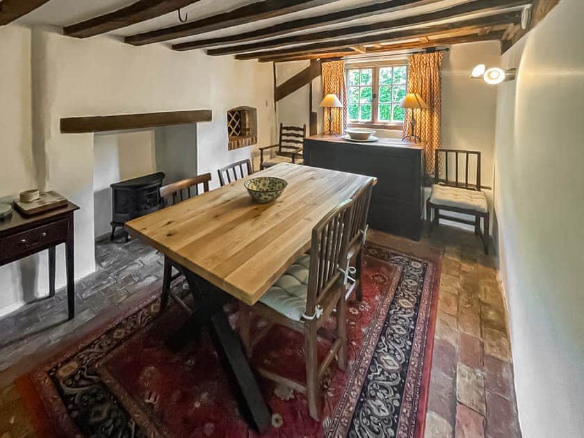 Dining room with bread oven and brick floor | Thatched Cottage, Sternfield, near Aldeburgh