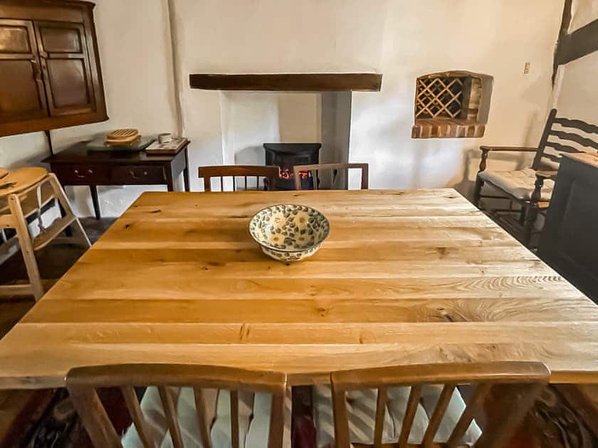 Dining room with bread oven and brick floor | Thatched Cottage, Sternfield, near Aldeburgh