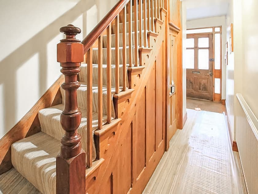 The entrance for this apartment is the door under the stairs  | Captain Jack’s, Porthmadog