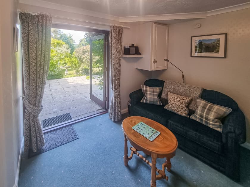 Additional ground floor seating area with French doors to garden | Harwood Dale Cottage, Kendal