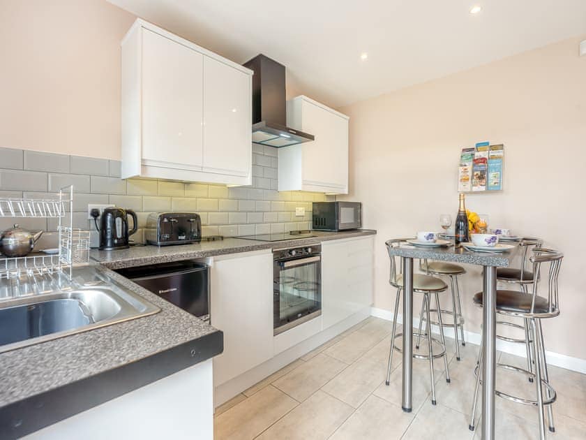 Well-equipped kitchen overlooking the garden | Jemmett Lodge, Mersham, near Ashford