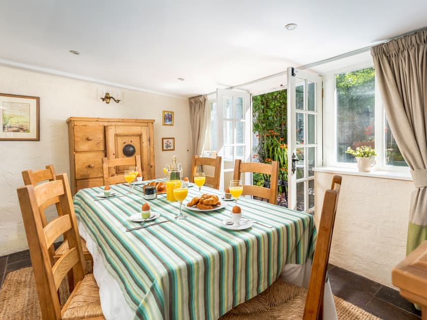 Dining room with flagstone floor | The Oval, Dunster
