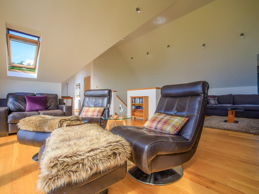 Comfortable living area with cosy wood burner | Locholly Lodge, Achiltibuie near Ullapool