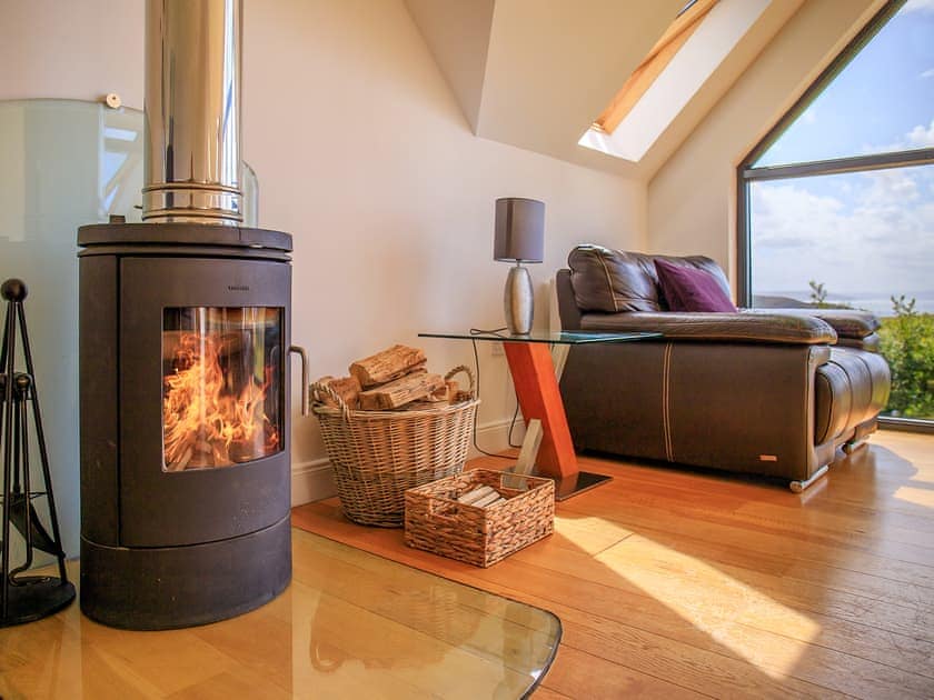 Comfortable living area with cosy wood burner | Locholly Lodge, Achiltibuie near Ullapool