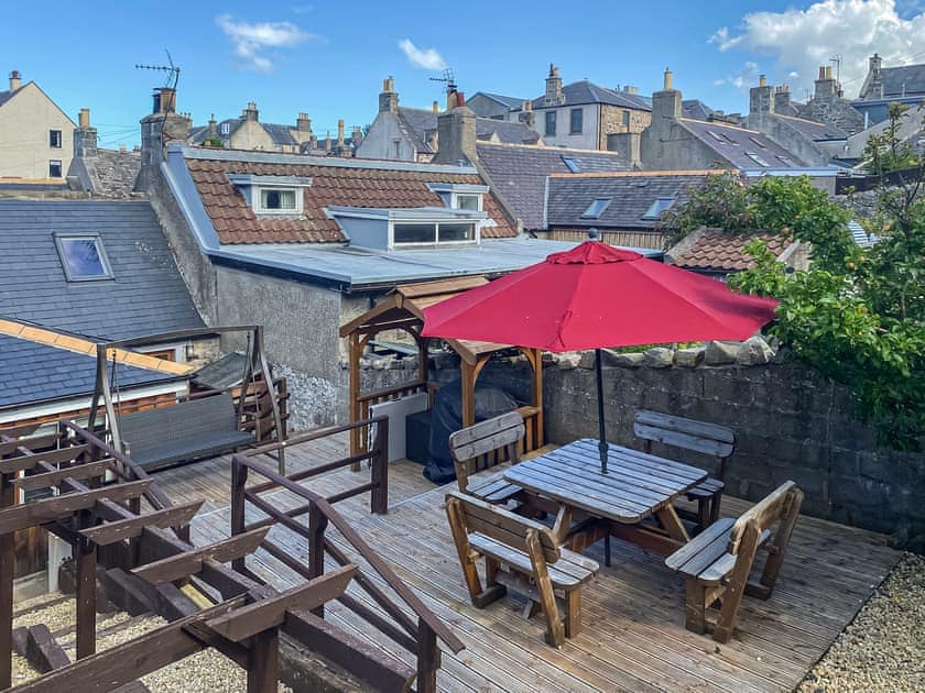 Private garden with dining and BBQ area | Viaduct View, Cullen, near Buckie