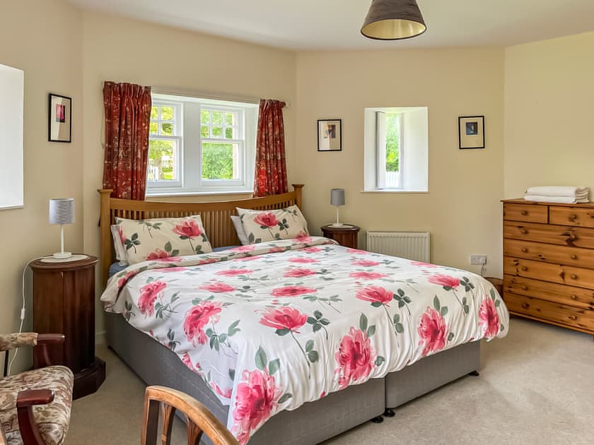 Welcoming double bedroom with super king bed and en-suite  | Dairy Cottage, Whitehouse, near Alford