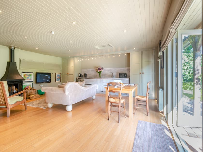 Cosy living area with wood burner | Lymington Lodge, Lymington
