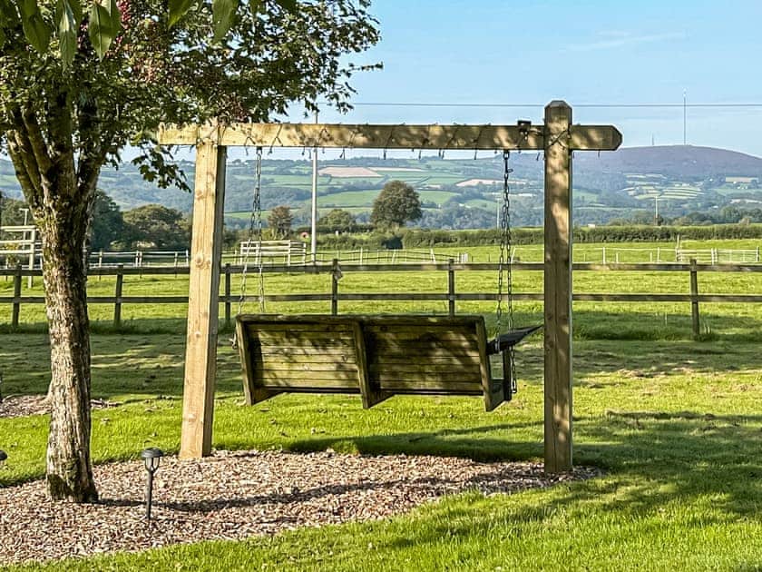 Romantic garden swing seat  | The Escape, South Hill, near Tamar Valley