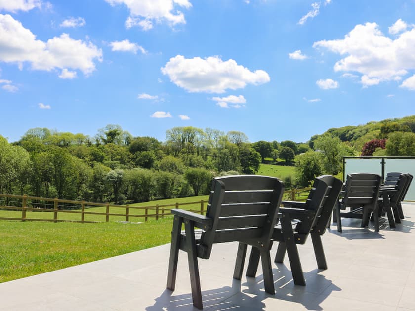Paved patio area with outdoor furniture | Tree Park, Halwell, near Totnes