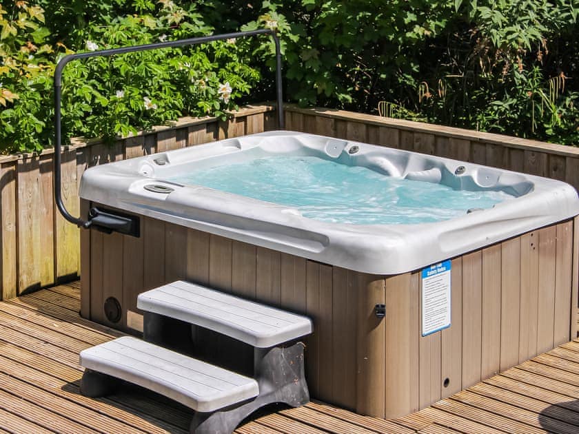 Garden with hot tub | Granary Cottage - Treberfedd Farm, Lampeter, near Aberaeron