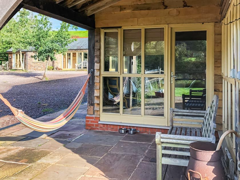 Relax and take in the view from the comfortable hammock | Beer Farm, Waterrow, near Wiveliscombe